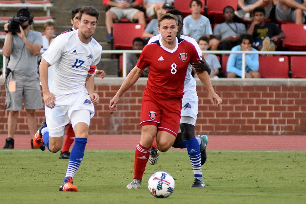 Freshman midfielder Brad Sweeney fights through UNC Asheville defenders on Tuesday, Sept. 26, 2017 at Dail Soccer Stadium. The Wolfpack won 3-0.