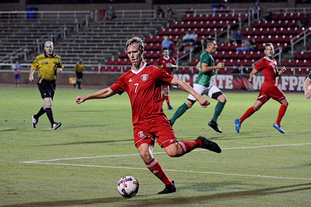 Tanner Roberts, a junior forwards, kicks at the ball during the men's soccer game against USC Upstate on Tuesday, October 10, 2017 in Dail Soccer Stadium. The Wolfpack tied with the Spartans 0-0, after two overtimes.