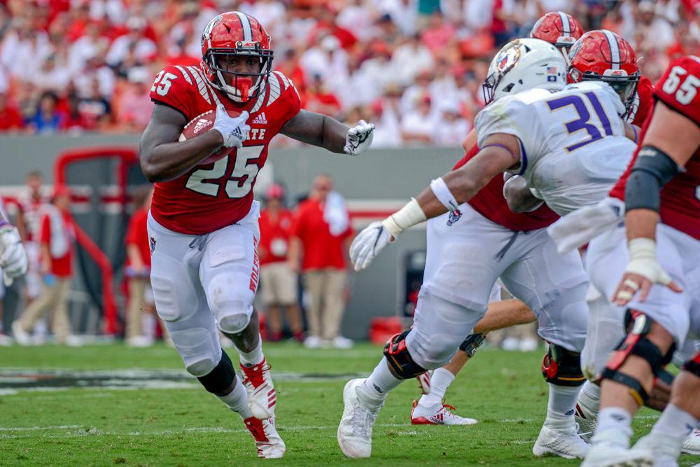 Senior running back Reggie Gallaspy, Jr. looks to find a way past the James Madison University defense on Saturday, Sept. 1 at Carter Finley Stadium. Gallapsy, Jr. scored a touchdown in the fourth corner to contribute to the Wolfpack win of 24-13 over JMU.