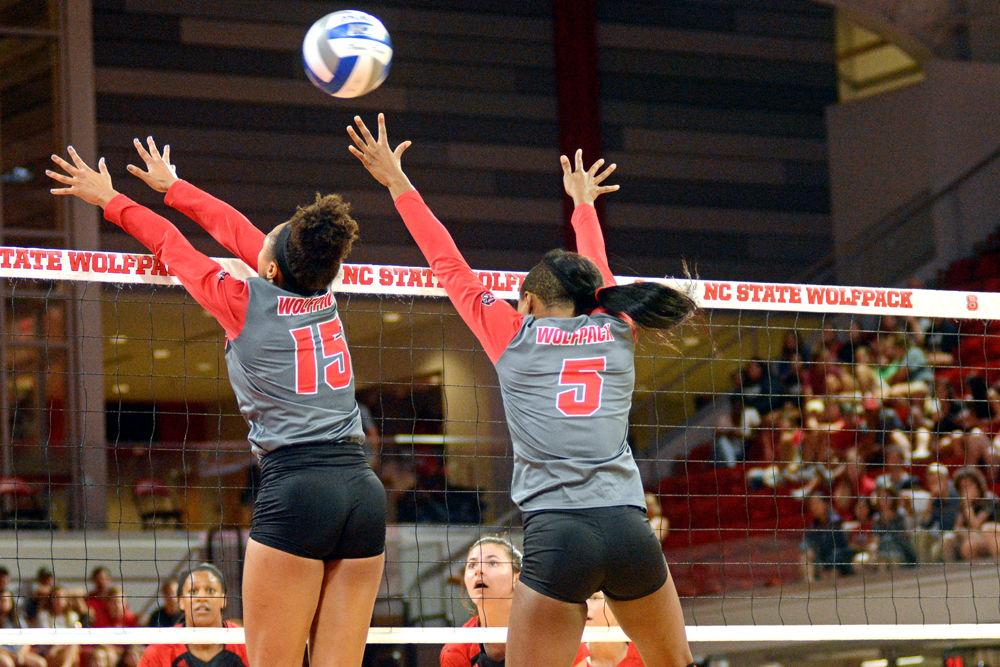 Freshman outside hitter Jade Parchment and graduate middle blocker Keira Moore attempt a block against Louisville on Friday, Sept. 21 at Reynolds Coliseum. Parchment had 11 kills and Moore had 8 kills as the Wolfpack lost 3-1.