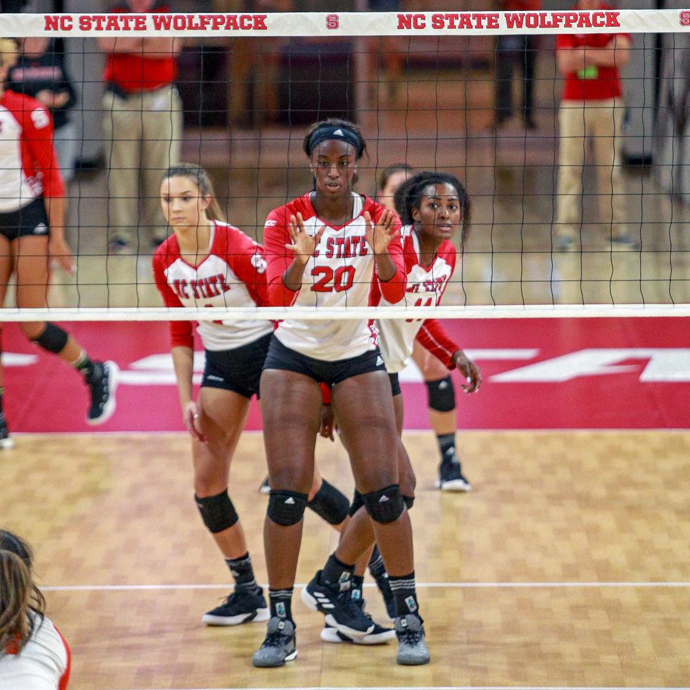 Junior middle blocker Lauryn Terry prepares to receive a serve as senior setter Kylie Pickrell and redshirt senior outside hitter Erin Chatman move into place alongside her. The Wolfpack defeated Campbell 3-0 on Sunday, Sept. 9 in Reynolds Coliseum.
