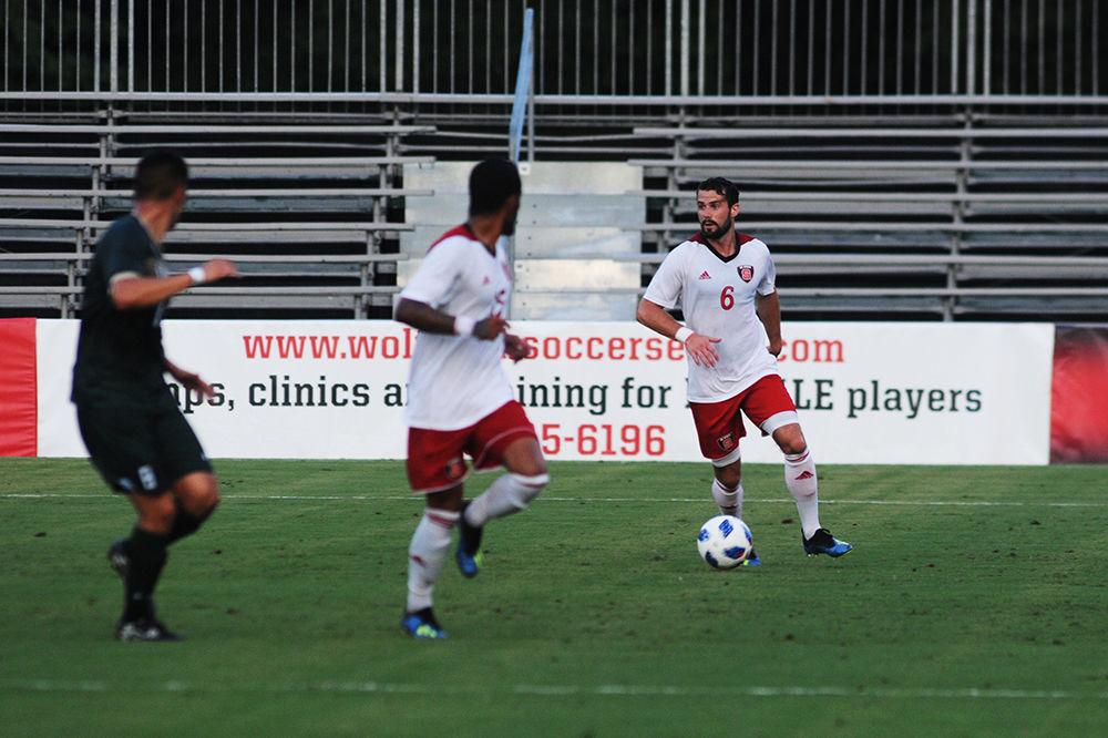 Junior defender Christoph Schneuwly looks for an opening in the William &amp; Mary defense at Dail Soccer Stadium on Monday, Sept. 3. Schenewly scored the winning goal in the second period of overtime, ending the game in a 2-1 win for the Wolfpack.