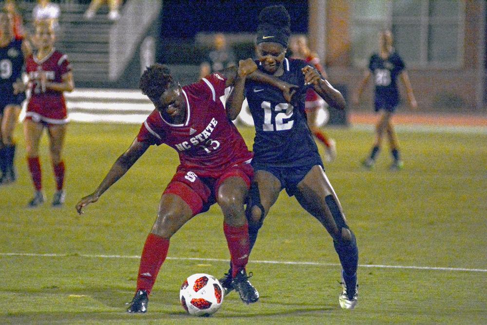 Senior defender Ella Bonner wrestles for control of the ball on Thursday, Sept. 6 at Dail Soccer Stadium. The Wolfpack beat George Washington 2-0.