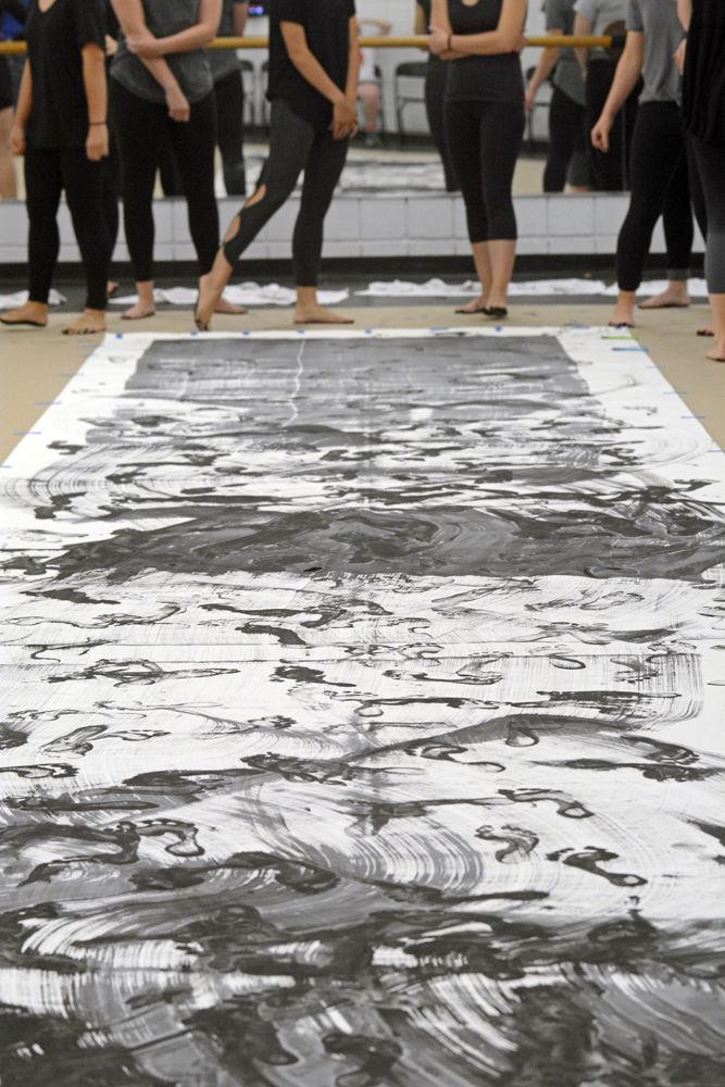 Members of NCSU Dance Company survey their execution of "John Cage's STEPS: A Composition For A Painting" for a Master Class in Carmichael Gym on Wednesday, Sept. 19. The Master Class Series, a program through the NC State Dance Program, offers free dance instruction to NC State students, staff, and faculty members at any expereience level.