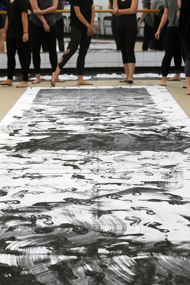 Members of NCSU Dance Company survey their execution of "John Cage's STEPS: A Composition For A Painting" for a Master Class in Carmichael Gym on Wednesday, Sept. 19. The Master Class Series, a program through the NC State Dance Program, offers free dance instruction to NC State students, staff, and faculty members at any expereience level.