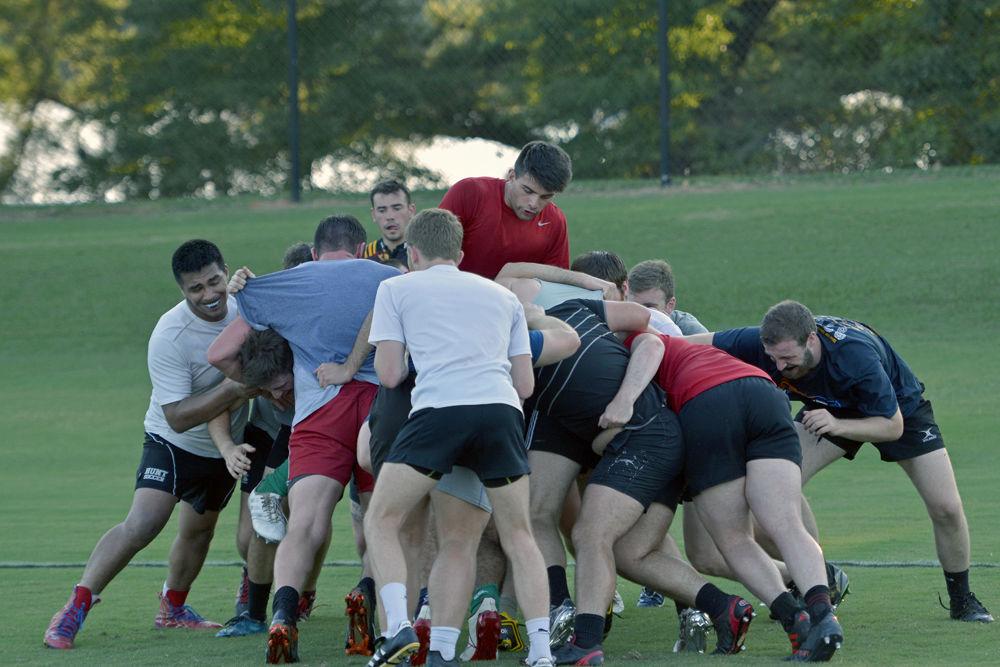 NC State Men's Club Rugby athletes battle during practice on Thursday, August 30 at Method Road Fields. The team is training to battle head to head against VMI on Saturday at home.