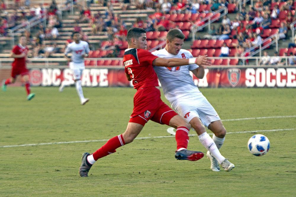 Sophomore midfielder Manny Perez lunges for the ball on Friday, Sept. 21, at Dail Soccer Field. NC State men's soccer had 7 shots on goal while keeping Virginia Tech to 3 shots on goal. The Wolfpack won 1-0.
