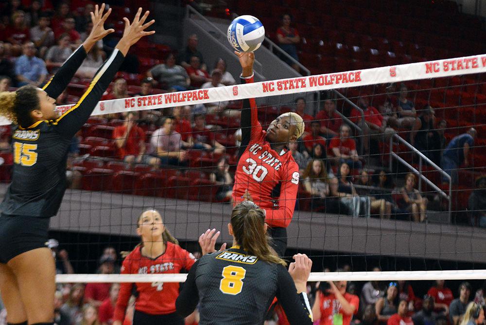 Teni Sopitan, a junior middle blocker, attempts to score a point during the volleyball match against Virginia Commonwealth University on Friday, Aug. 24 at Reynolds Coliseum. The Wolfpack beat the Rams 3-2 for their first win of the 2018 season.&#160;