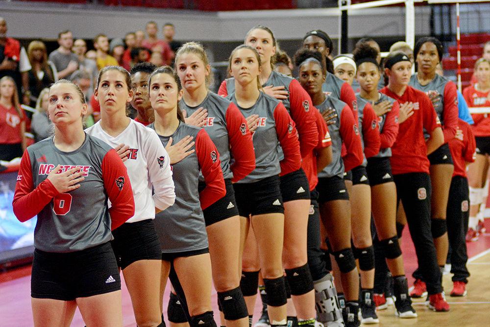 NC State Volleyball stands for the national anthem before playing Louisville on Friday, Sept. 21 at Reynolds Coliseum. The Wolfpack lost 3-1.