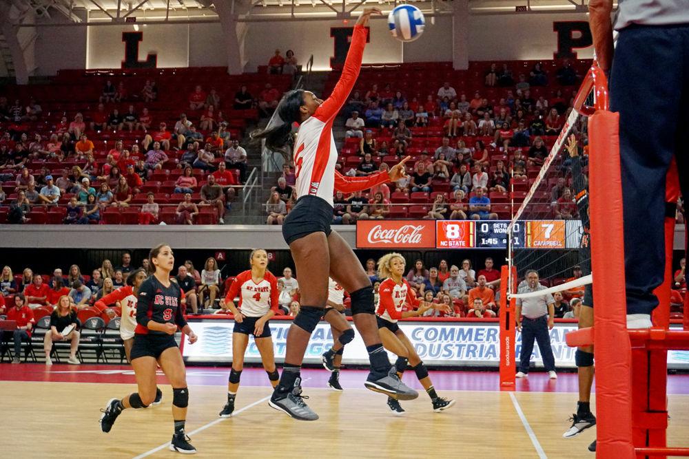 Keira Moore a graduate middle blocker goes up for a kill. Moore had six kills. NC State won against Campbell 3 - 0 on Sunday, Sept. 9.