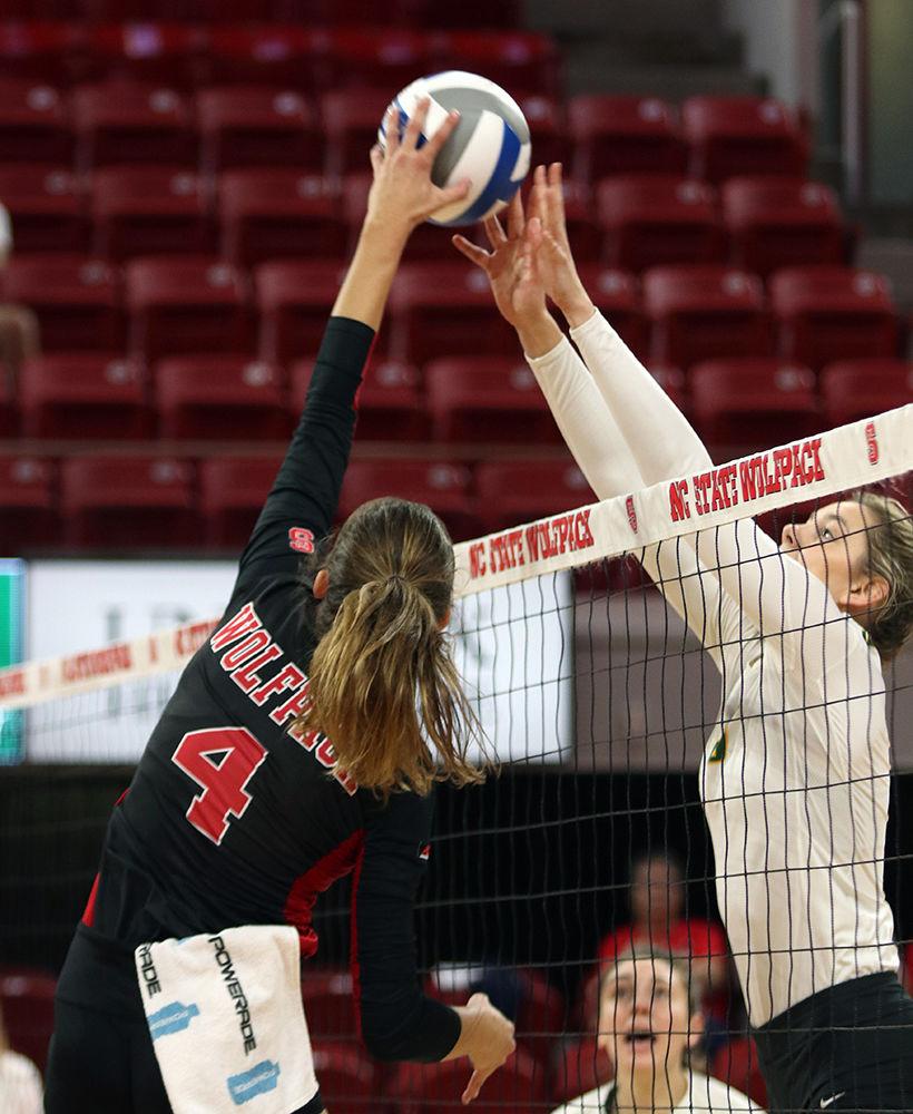 Kylie Pickrell, a senior setter, goes in for the spike against the Wright State University Raiders. The Wolfpack emerged victorious, winning 3-0 on Sept. 7, 2018 at Reynolds Coliseum.