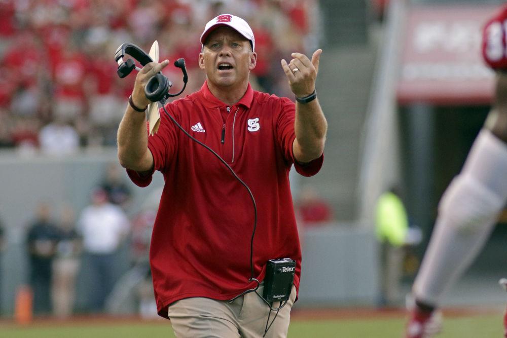 Head coach Dave Doeren brings his players in for a huddle against Old Dominion on Sept. 17, 2016 at Carter-Finley Stadium. The Wolfpack offense produced a total of 470 yards in their 49-22 win.