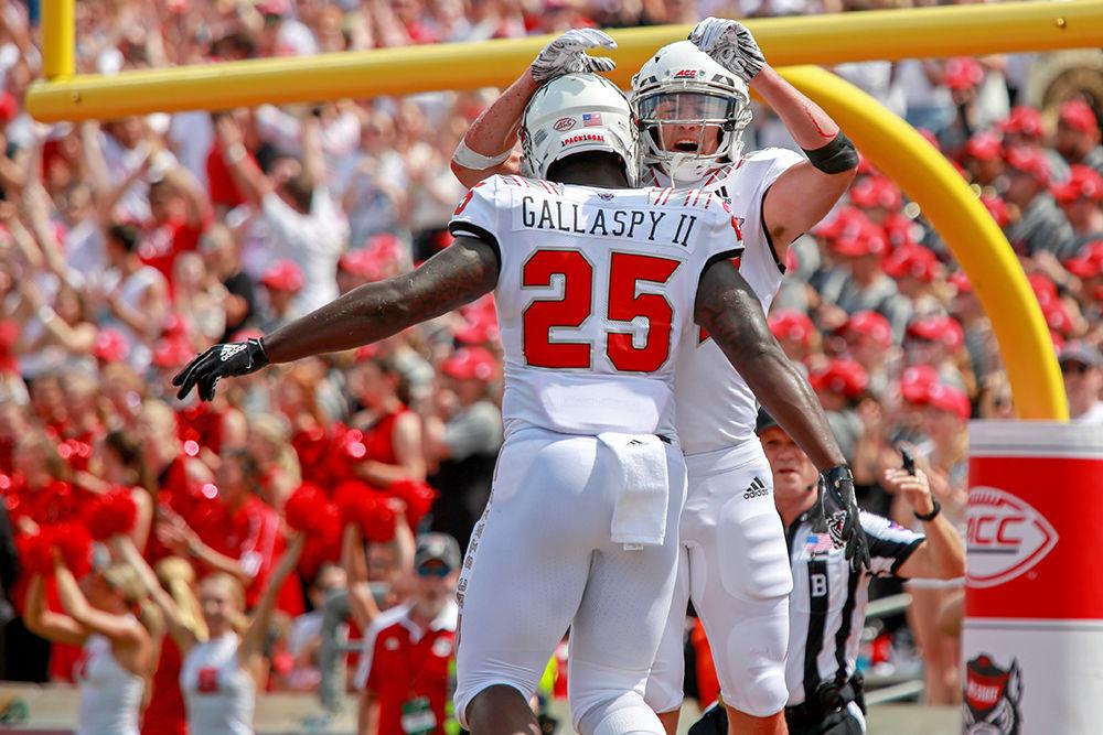 Redshirt freshman wide receiver Thayer Thomas celebrates with senior running back Reggie Gallaspy Jr. after Thomas' touchdown in the first quarter. Thomas had a breakout game with 114 yards on 9 receptions during the 41-7 win over Georgia State on Saturday, Sept. 8 in Carter-Finley Stadium.