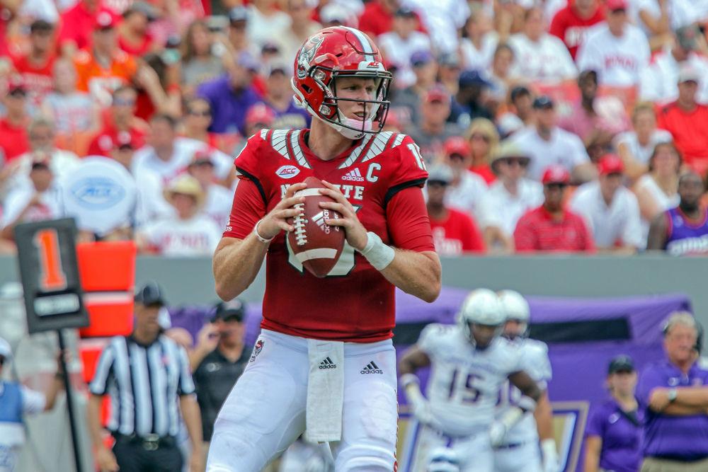 Graduate quarterback Ryan Finley analyzes the James Madison defense. Finley had 309 yards through the air during the 24-13 win over James Madison on Saturday, Sept. 1 in Carter-Finley Stadium.