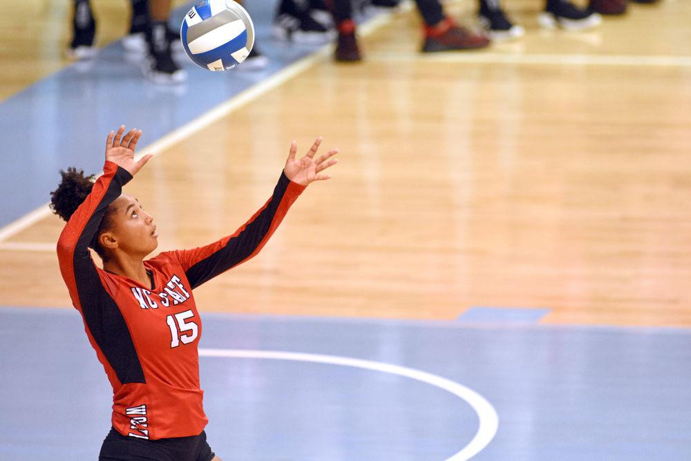 Freshman outside hitter Jade Parchment prepares to serve the ball against UNC at Carmichael Arena on Wednesday, Sept. 27. Parchment had 11 kills and 13 digs. The Wolfpack lost to the Tar Heels 3-1.