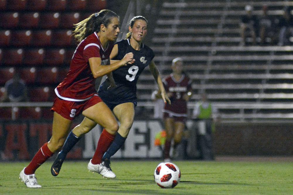 Senior midfielder Taylor Porter dribbles the ball at Dail Soccer Stadium on Thursday, Sept. 6. The Wolfpack beat George Washington 2-0.