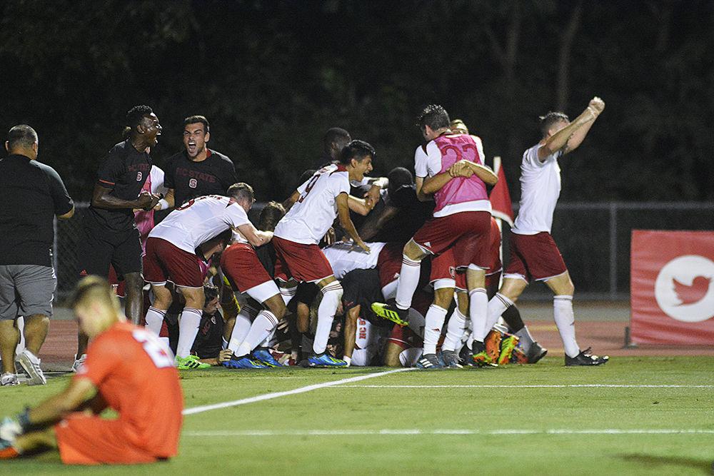 The N.C. State men's soccer team celebrates their sudden death overtime victory&#160;against William &amp; Mary at Dail Soccer Stadium on Monday, Sept 3. The game-winning goal was delivered by junior defender Christoph Schneuwly in the second period of overtime play.