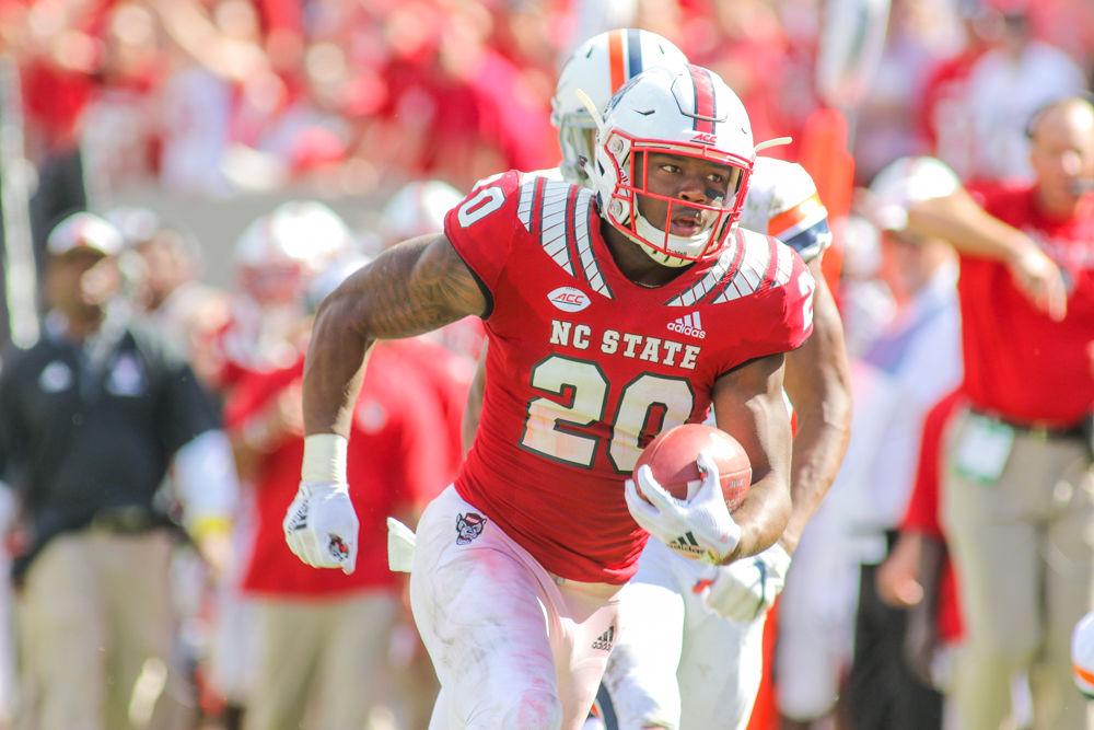 Freshman runningback Ricky Person runs up field for a huge 38 yard gain. Person had a monstrous day with 108 yards on 14 carries. The Wolfpack handled Virginia 35-21 on Saturday, Sept. 29 in Carter-Finley Stadium.
