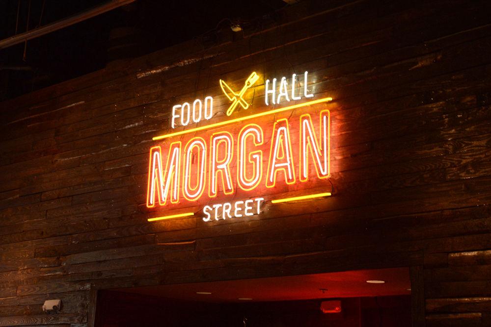 A neon sign hangs up in the Morgan St. Food Hall on Sept. 9, 2018, in downtown Raleigh.