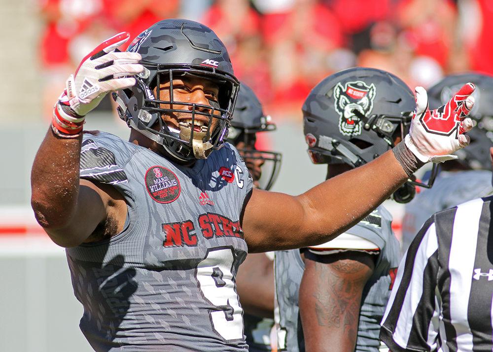 Senior defensive end Bradley Chubb coaxes more excitement out of the crowd during the 33-25 win over Syracuse on Saturday, Sept. 30, 2017 at Carter-Finley Stadium.