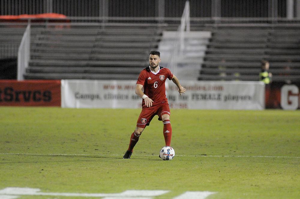 Junior defender Christoph Schneuwly looks for an open teammate at the N.C. State V. Boston College men's soccer game in Dail Soccer Stadium on Friday, Oct. 27. The two teams tied with a score of 0-0 after two ten minute over time sessions.