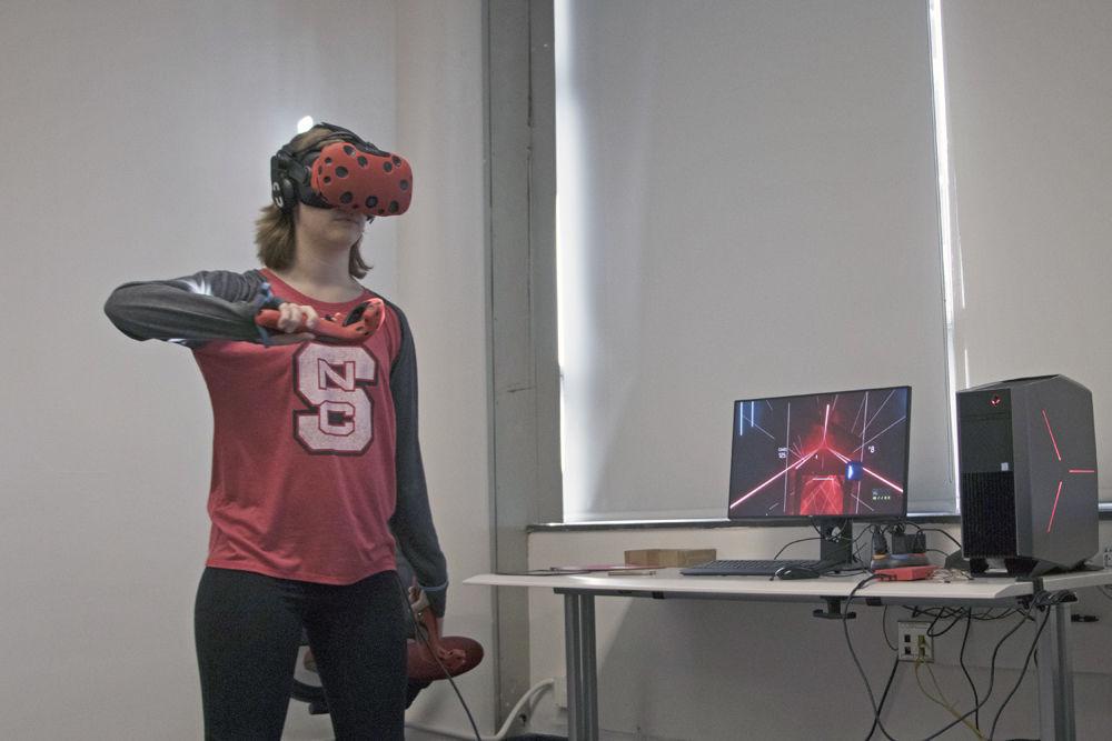 Rose Hood, a student in the First Year Life Sciences program, uses an HTC Vive in the VR Studio on Monday, Sept. 24. The VR Studio is in D.H. Hill Library rooms 2317 and 2318.