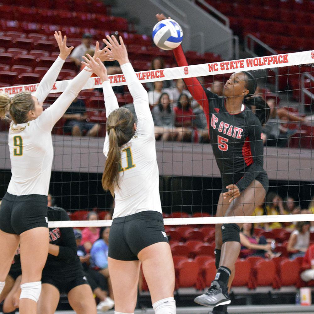 Keira Moore, a graduate middle blocker, hits the ball during the game against Wright State on Friday, Sept. 7, 2018 at Reynolds Coliseum. The Wolfpack beat the Raiders 3-0 for their bringing up their win record to 4-2.