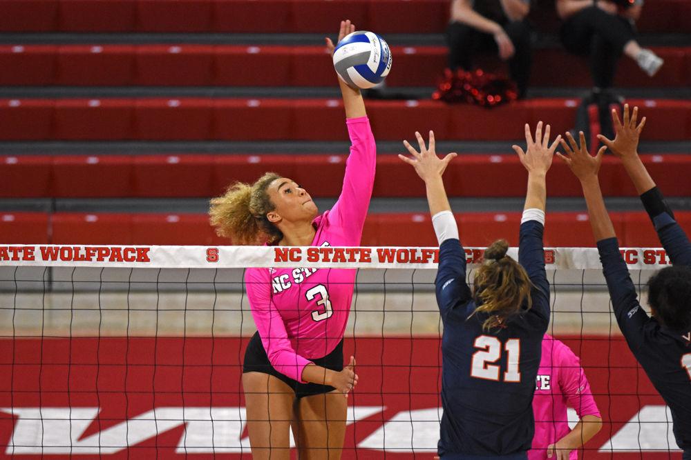Sophomore opposite hitter Melissa Evans hits the ball against Virginia at Reynolds Coliseum on Friday, Oct. 12. Evans had 14 kills and 4 digs as the Wolfpack won 3-1.