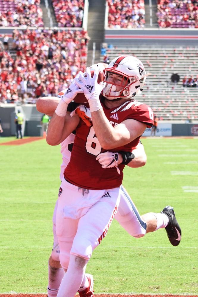 Redshirt sophomore tight end Cary Angeline catches his first career touchdown for the Wolfpack on Saturday, Sept. 29, 2018 at Carter-Finley Stadium. Angeline had 14 receiving yards resulting in one touchdown, which head coach Dave Doeren said was "the first of many." The Wolfpack beat UVA 35-21.