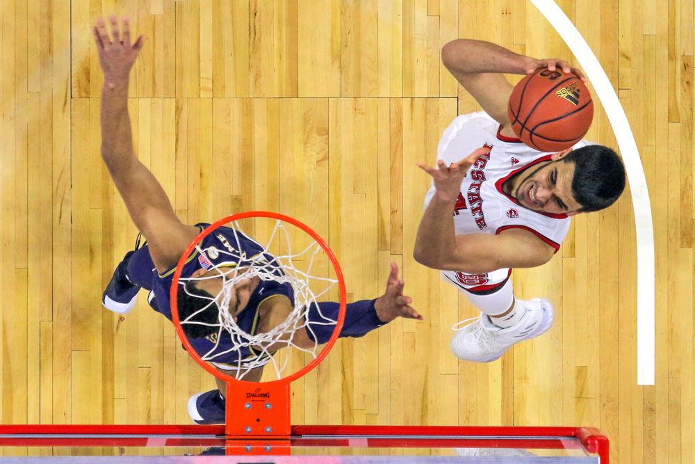 Sophomore center Omer Yurtseven takes a shot from the low post against Notre Dame on Saturday, Feb. 3 at PNC Arena. Yurtseven had a double-double with 10 points and 10 rebounds. The Wolfpack lead by as much as 30 on the way to a 76-58 win.