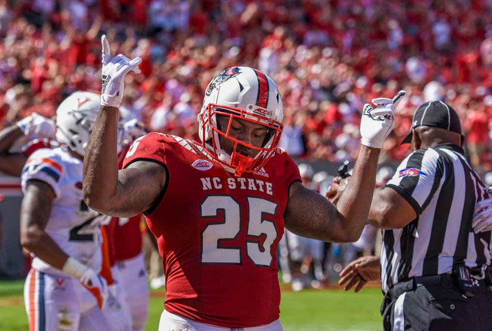 Senior running back Reggie Gallaspy Jr. celebrates a touchdown on Saturday, Sept. 29, at Carter-Finley Stadium. The Wolfpack beat Virginia 35-21.