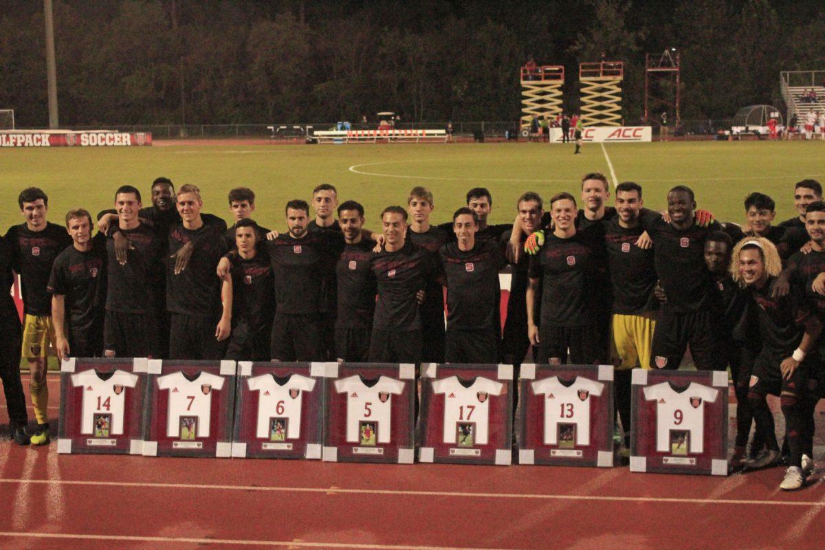 The team poses for a picture with the seven seniors players on Saturday, Oct. 20 at Dail Soccer Stadium. The seniors and their families were recognized before the game against Syracuse for senior night. The Wolfpack tied with the Orange 1-1.