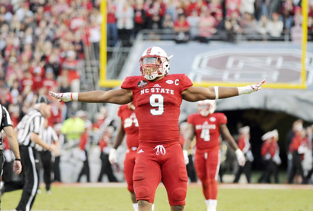 Senior defensive end Bradley Chubb celebrates after a play at the NC State football game against UNC-Chapel Hill in Carter-Finley Stadium on Saturday. The Wolfpack beat the Tar Heels, 21-33, claiming their eighth win of the season.