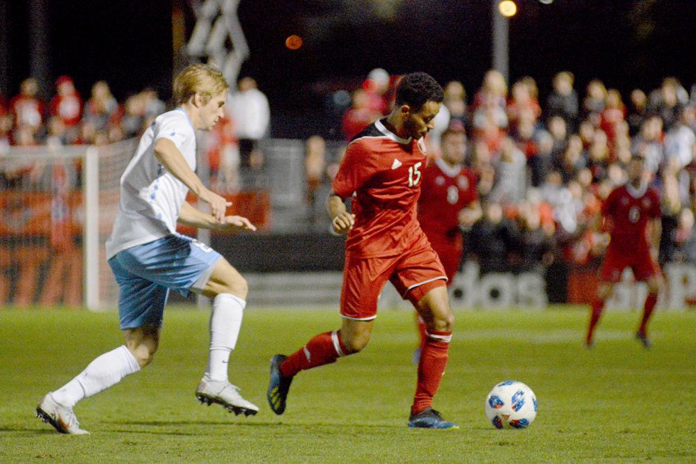 Junior midfielder Gabriel Machado dribbles the ball on Friday, Oct. 12 at Dail Soccer Stadium. The Wolfpack beat No. 1 UNC-Chapel Hill 1-0.