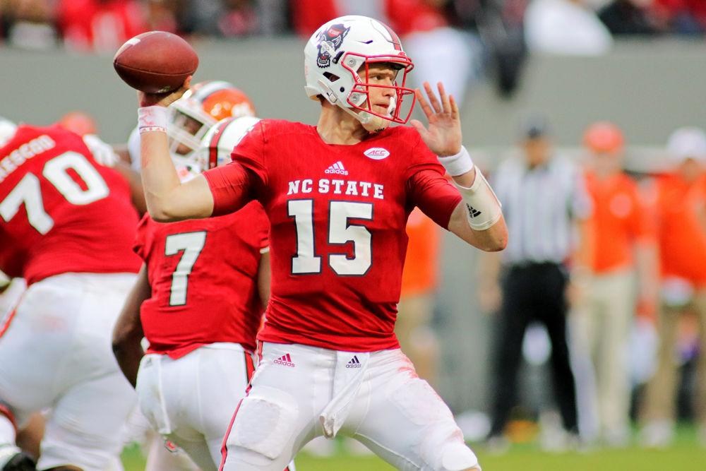 Graduate quarterback Ryan Finley pulls back to fire a pass on Saturday, Nov. 4, 2017 in Carter-Finley Stadium. Finley totaled 338 passing yards in the game as the Wolfpack lost to Clemson 38-31.