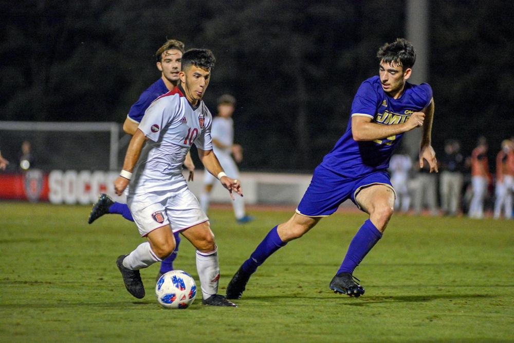 Sophomore forward David Loera attacks the James Madison defense on Tuesday, Oct. 2 at Dail Soccer Field. Despite two overtime periods, the match ended in a 0-0 tie.