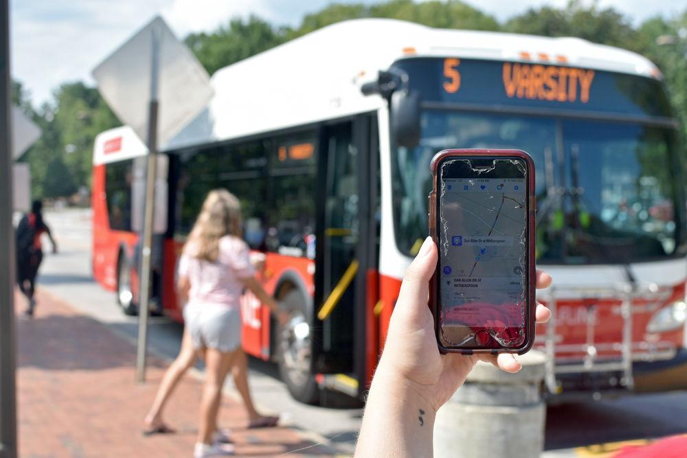 A student uses the TransLoc Rider app. Many NC State students have expressed difficulty navigating the app.
