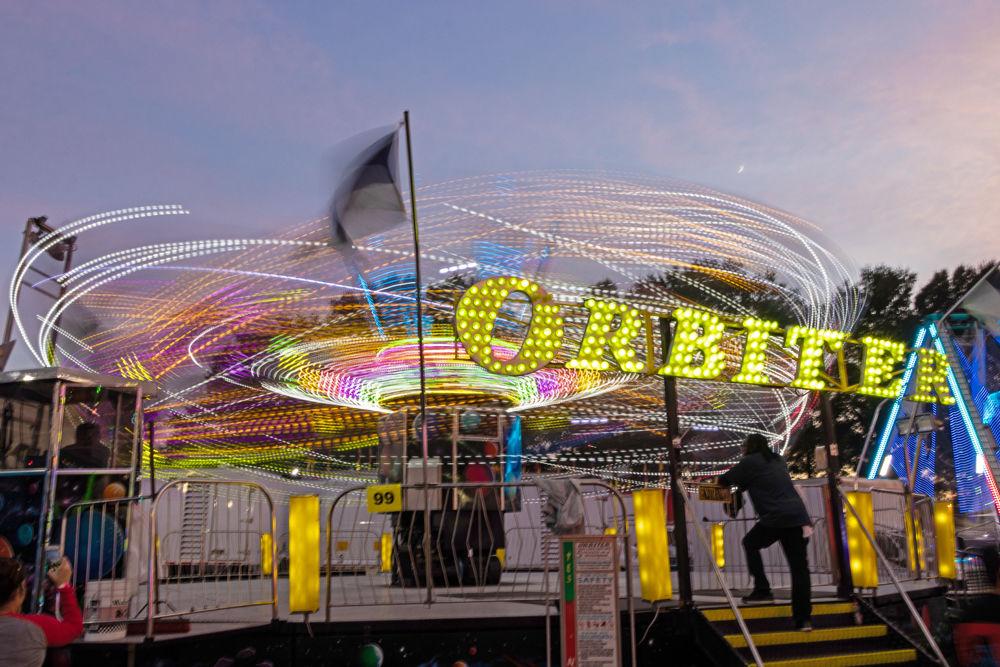 Attendees ride The Orbiter at the 2018 NC State Fair on Friday, Oct. 12. The 2017 N.C. State Fair had an attendance of over one million visitors.