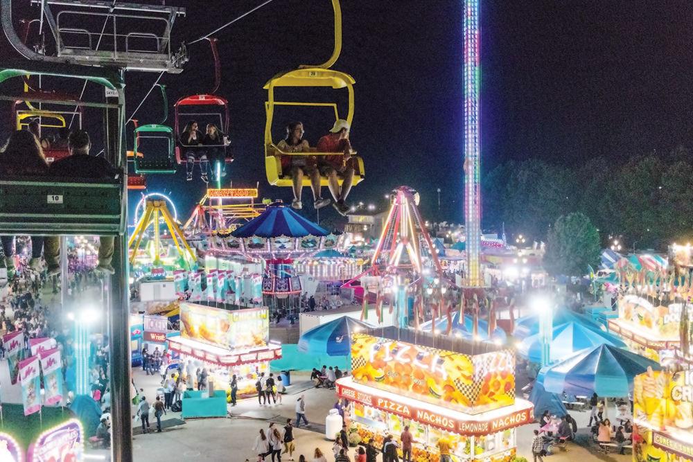 Attendees enjoy the attractions at the 2018 North Carolina State Fair on Friday, Oct. 12. The 2017 State Fair had an attendance of over one million visitors.