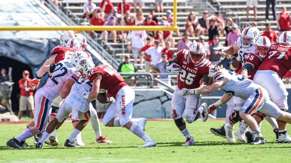 Senior running back Reggie Gallaspy, Jr. avoids getting tackled by a Virginia player on Sunday, Sept. 29 at Carter-Finley Stadium. Gallaspy Jr. had 47 yards on 14 carries and 1 touchdown as the Wolfpack beat UVA 35-21.