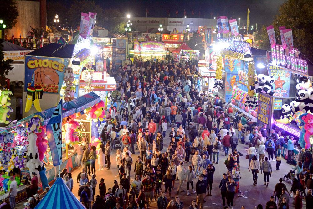 Thousands of fairgoers move through the midway on Oct. 19, 2017. Over 1 million people attended the 2017 NC State Fair held from Oct. 12-22, 2017 with Saturday, Oct. 21 seeing the largest number of attendees at 148,424. The fair offered a plethora of different fried foods to enjoy, games to play and rides to experience, as well as musical performances, agricultural exhibits and livestock shows.