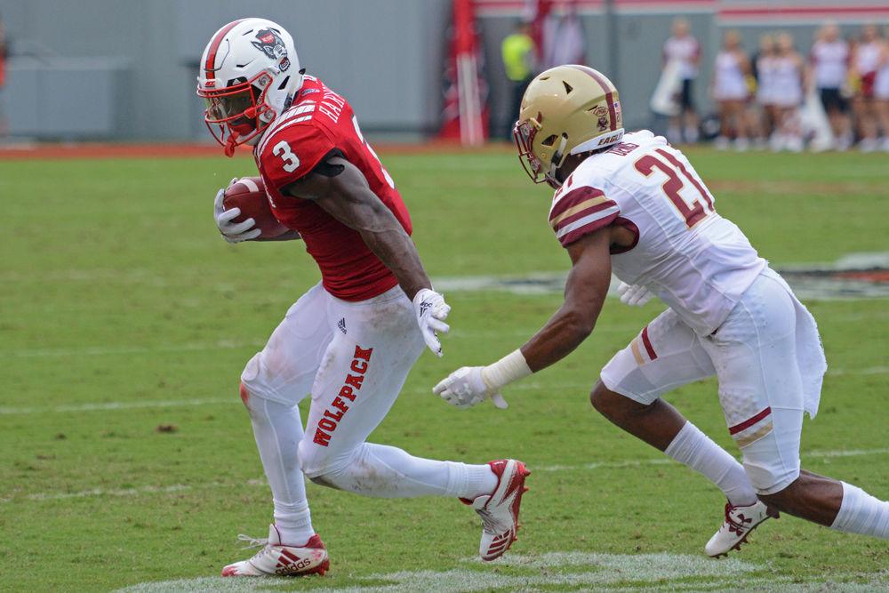 Junior wide receiver Kelvin Harmon turns upfield and tries to break away from Boston College defensive back Lukas Denis after catching a pass on Saturday, Oct. 6 at Carter-Finley Stadium. Harmon caught 9 passes for 128 yards and 1 touchdown as the Wolfpack beat Boston College 28-23.