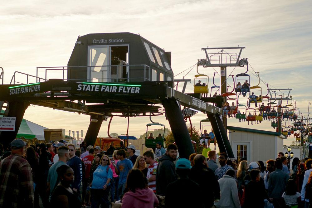 The State Fair Flyer is a ski lift-style ride that takes visitors across the fair. Over 120,000 people attended the 2018 N.C. State Fair on Saturday, Oct. 13.