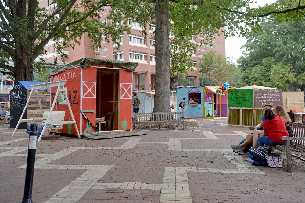 Twenty shacks built by various campus organizations occupy the Brickyard for Shack-A-Thon on Monday, Sept. 24. Shack-A-Thon is a student-run fundraiser that began in 1998 to bring increase awareness to the issue of affordable housing and has since raised over $450,000 for Habitat for Humanity of Wake County.