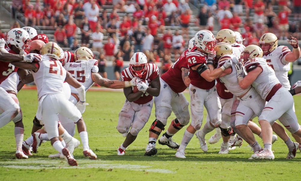 Senior running back Reggie Gallaspy Jr. breaks through the line on Saturday, Oct. 6 at Carter-Finley Stadium. Gallaspy Jr. totaled 104 yards on 25 carries as the Wolfpack won 28-23.