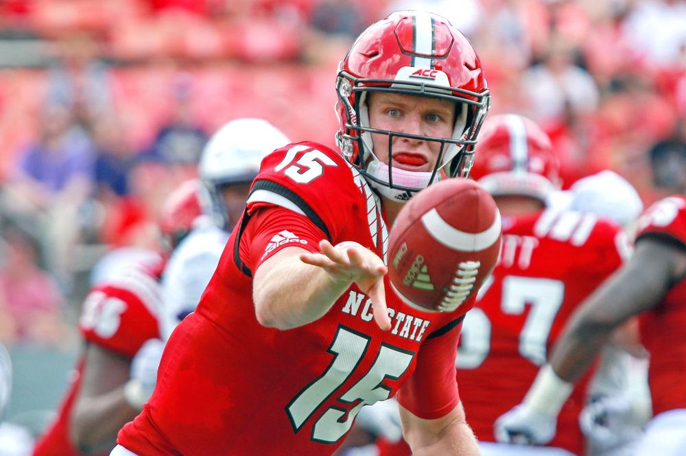 Graduate quarterback Ryan Finley pitches the ball on Saturday, Sept. 1 in Carter-Finley Stadium. The Wolfpack beat James Madison 24-13.