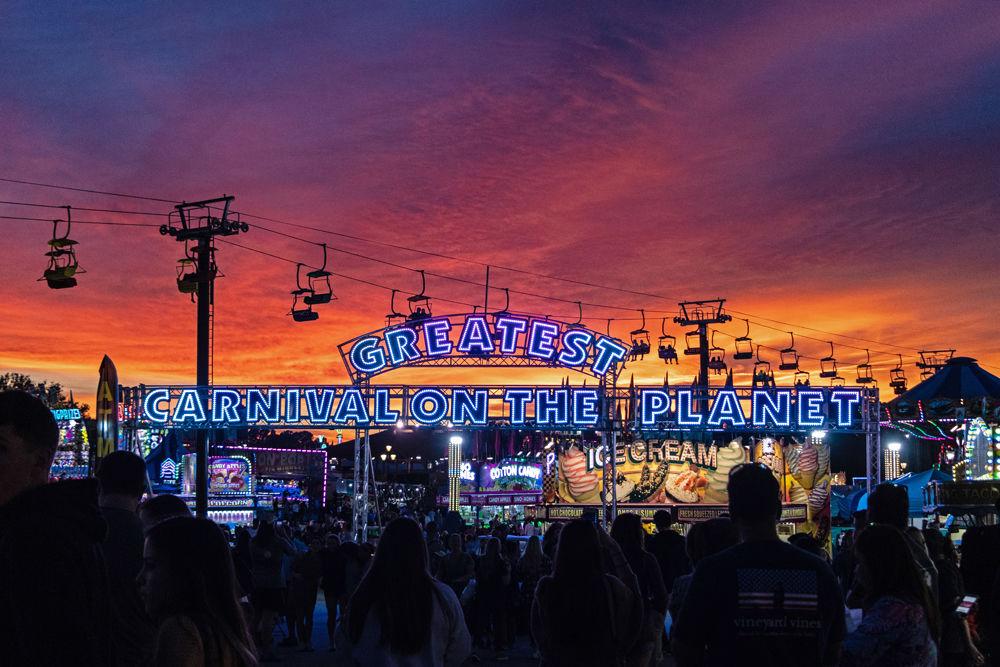 Attendees enjoy the attractions at the 2018 N.C. State Fair on Friday, Oct. 12. The 2017 N.C. State Fair had an attendance of over one million visitors.