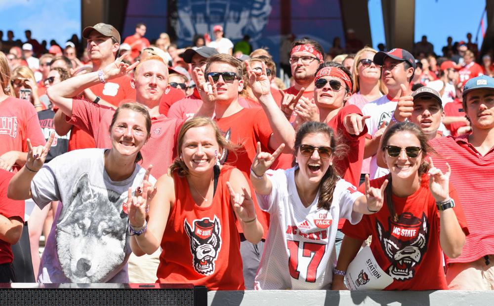 NC State students cheer on the Wolfpack at Carter-Finley Stadium on Sunday, Sept. 29. The Wolfpack beat UVA 35-21.