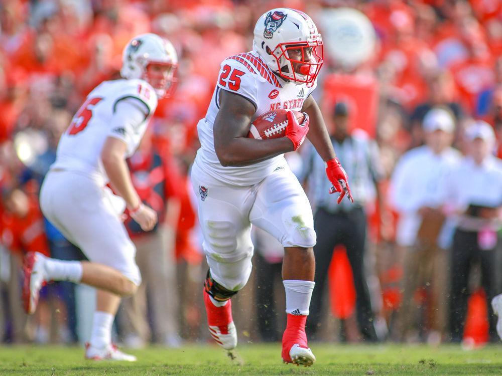 Senior running back Reggie Gallaspy Jr. carries the ball against Clemson on Saturday, Oct. 20 at Clemson Memorial Stadium. Gallaspy had a team-high 59 yards rushing on 9 carries as the Wolfpack lost 41-7.