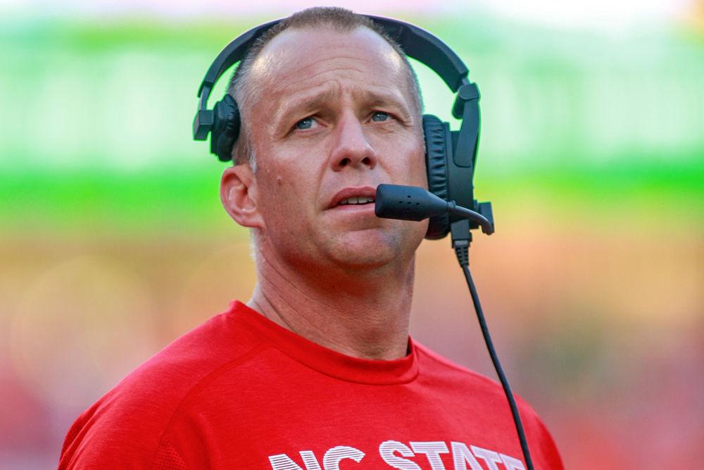 Head coach Dave Doeren checks the scoreboard during the 41-7 loss to Clemson at Clemson Memorial Stadium on Saturday, Oct. 20. Doeren is 0-6 against Clemson as head coach of the Wolfpack.